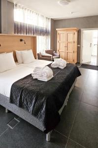 Postel nebo postele na pokoji v ubytování Villa Valkenburg