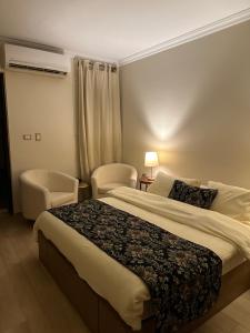A bed or beds in a room at Rentrific