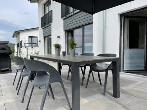 a table and chairs sitting on a patio at Diemelblick 17 in Heringhausen
