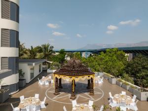 an aerial view of a restaurant with tables and a gazebo at Ekante Bliss Tirupati - IHCL SeleQtions in Tirupati