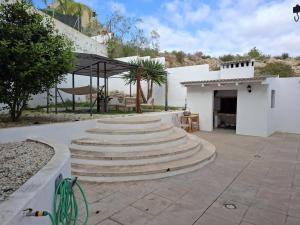 a group of concrete stairs in a courtyard at 3 Bed Chalet-Pool-Pets-Hot Tub-Parking-Garden in Chiva