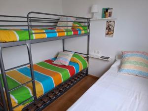 a bunk bed room with two bunk beds next to each other at 3 Bed Chalet-Pool-Pets-Hot Tub-Parking-Garden in Chiva +18 photos