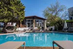 a large swimming pool with a gazebo at Costa Bodrum City in Bodrum City