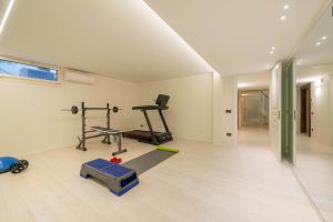 a room with a gym with a treadmill and a treadmill at Villa Isabella - Venice Retreat - Swimming Pool and Garden in Venice