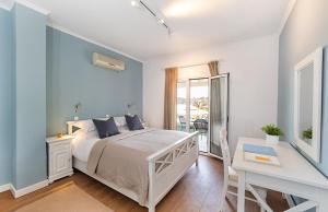 Postel nebo postele na pokoji v ubytování Bella Mare Hotel