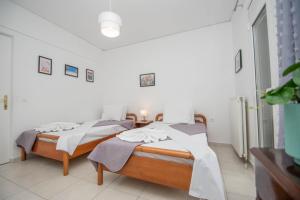 Postel nebo postele na pokoji v ubytování Lemon Tree Zante city Apartment by "elite"