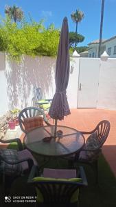 an umbrella sitting on top of a table at Apartamento Ambar in Novo Sancti Petri