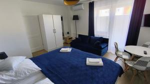 Łóżko lub łóżka w pokoju w obiekcie La Mer Pokoje i Apartamenty