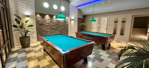 a billiard room with two pool tables in it at Argiri Resort Hotel & Apartments in Kardamaina