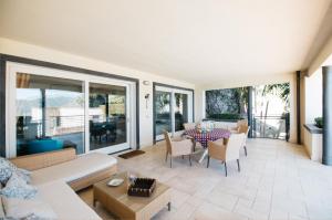 a living room with a couch and a table at Taormina Chic Apartment in Taormina