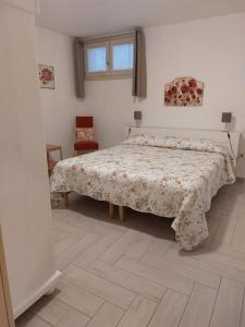 En eller flere senge i et værelse på Casa sotto la Quercia