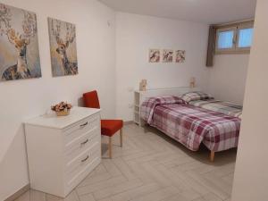 En eller flere senge i et værelse på Casa sotto la Quercia