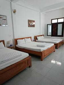 Säng eller sängar i ett rum på An Homestay & Hostel