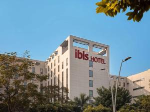 a big building with a bus hotel sign on it at ibis New Delhi Aerocity - An Accor Brand in New Delhi