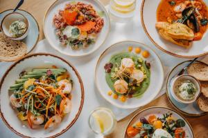 a table with plates of food on it at Elements Hotel&Spa in Świeradów-Zdrój