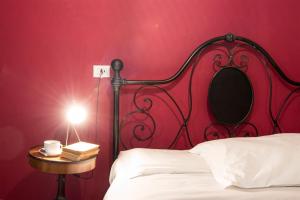 A bed or beds in a room at Colosseum B