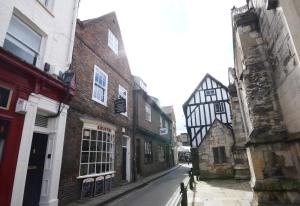 an alley in an old city with tall buildings at Patrick's Pool- 4 Bedroom,4 Bathroom, Most Central Luxury Townhouse! in York