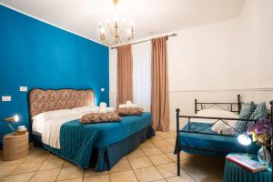 A bed or beds in a room at Colosseum B