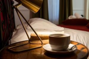A bed or beds in a room at Colosseum B