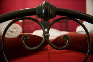 A bed or beds in a room at Colosseum B