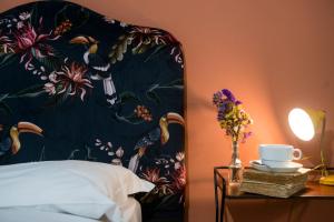 A bed or beds in a room at Colosseum B