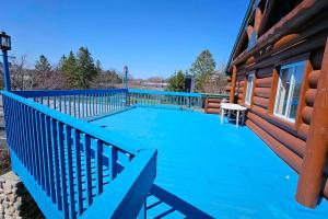 a large swimming pool on the side of a house at Days Inn by Wyndham Mackinaw City - Bridgeview Area in Mackinaw City