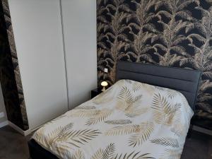 เตียงในห้องที่ L'ECRIN du ROUERGUE