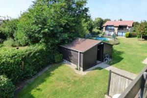 an aerial view of a backyard with a shed at Wijk de Brabander 134 in Cadzand