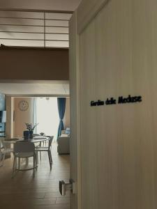 a room with a table and a dining room at Memo - Mediterranean Emotions in San Vito lo Capo