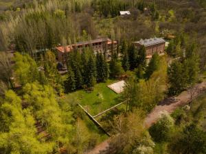 an overhead view of a building in a field with trees at Park Resort Aghveran in Agveran
