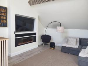 Ein Sitzbereich in der Unterkunft 360 Town Stay Apartments & Studios