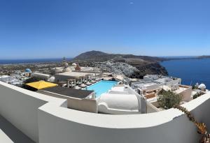 arial view of a resort with a swimming pool at Villa DALI Danae in Fira