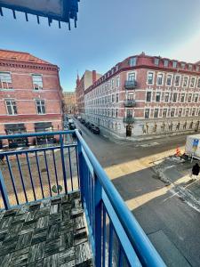 a view of a city street from a balcony at Norhemsgatsn 23 in Gothenburg