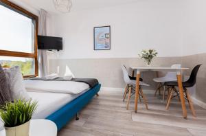 Łóżko lub łóżka w pokoju w obiekcie Palm Aparts Gdańsk