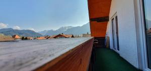 a balcony of a building with a view of mountains at Ferienwohnungen Wolf - Wohnung "Falkenstein" mit 3 Zimmer in Pfronten +11 photos