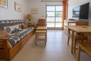 a living room with a couch and a table at Apartamento Terraza Bora Bora in El Campello