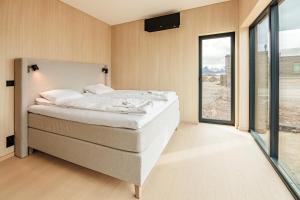 Ένα ή περισσότερα κρεβάτια σε δωμάτιο στο Northern Cabin Retreat