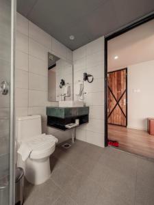 a bathroom with a toilet and a sink at Jade City Hotel in Pokhara