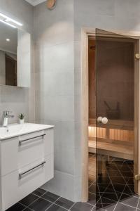 a bathroom with a sink and a shower at Martebäcken 19 in Sälen