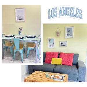 uma sala de estar com uma mesa e um sofá em California Dream Inn em Aljezur