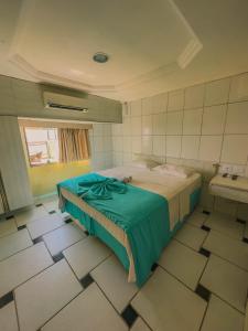 Ένα ή περισσότερα κρεβάτια σε δωμάτιο στο Hotel Arrecife dos Corais