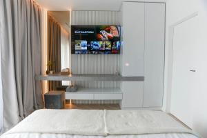 Ένα ή περισσότερα κρεβάτια σε δωμάτιο στο White Residence