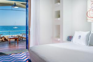 Postel nebo postele na pokoji v ubytování Capo la Gala Hotel&Wellness + 37 fotografií