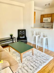 a living room with a coffee table and a couch at 124-2 Bedroom 2 Bath Apt in Heart of Hoboken in Hoboken