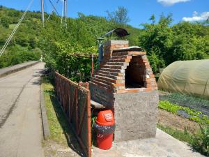 a brick oven on the side of a road at Apartman Sadba in Goražde