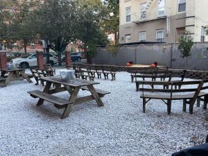 a group of picnic tables in a park at 211-Spacious 2Bed 2 Bath in the heart of Hoboken in Hoboken
