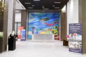 a large painting of a mermaid on a wall in a building at Royal Suites Studio 18ZY - Citra Plaza Nagoya in Jodoh