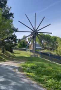 a windmill on the side of a road at Panoramahotel Steirerland in Kitzeck im Sausal