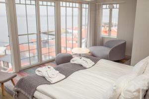 Rúm í herbergi á Gullmarsstrand Hotell & Konferens
