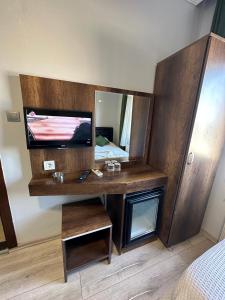 a room with a vanity with a large mirror at Ganita Life Hotel in Trabzon